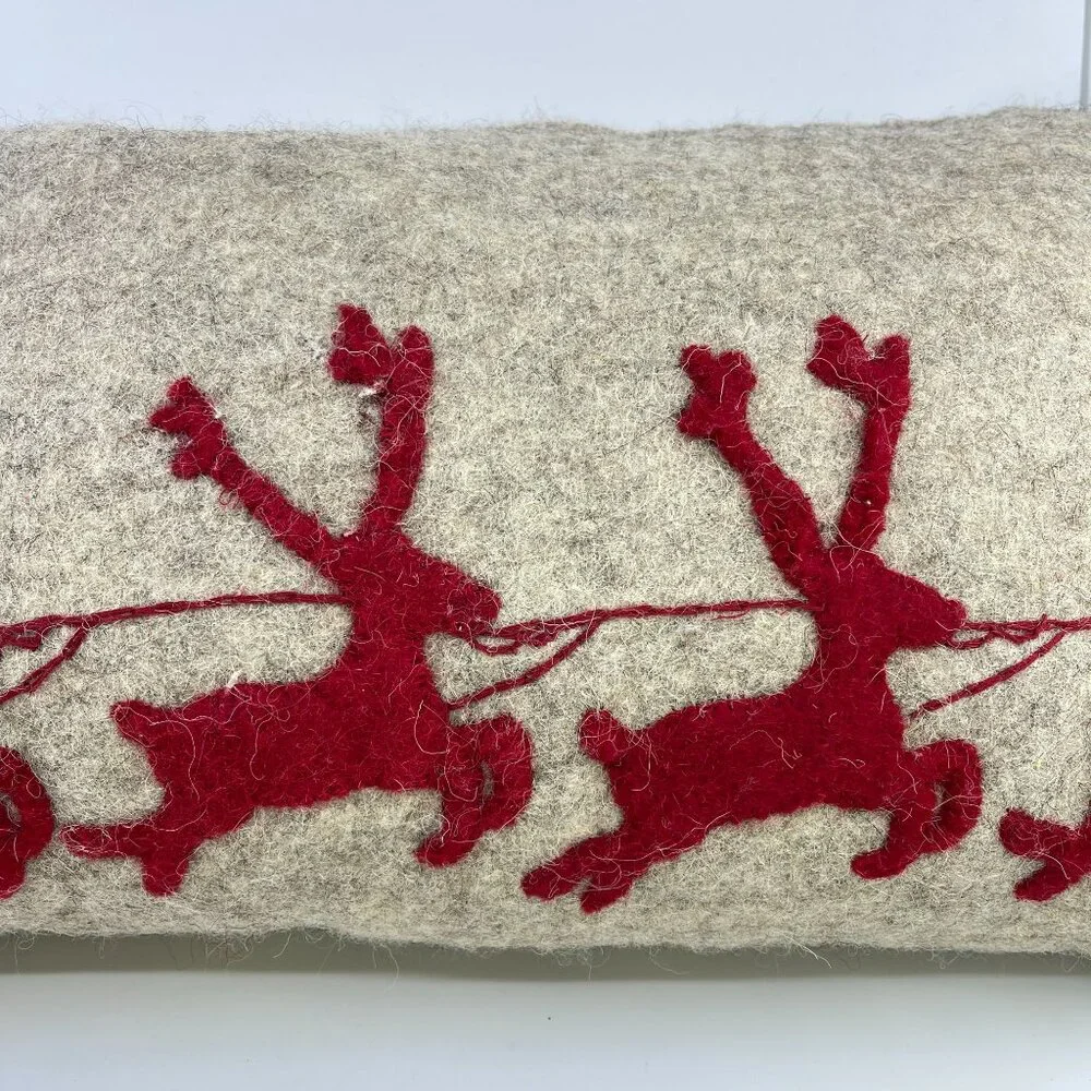 handmade wool felt rectangular pillow with red sleigh and reindeer design